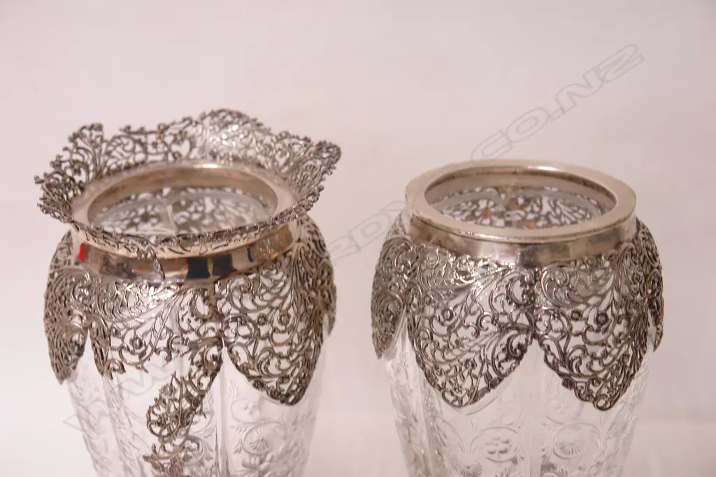 A pair of Edwardian elaborately silver mounted decorative glass vases Image 1++