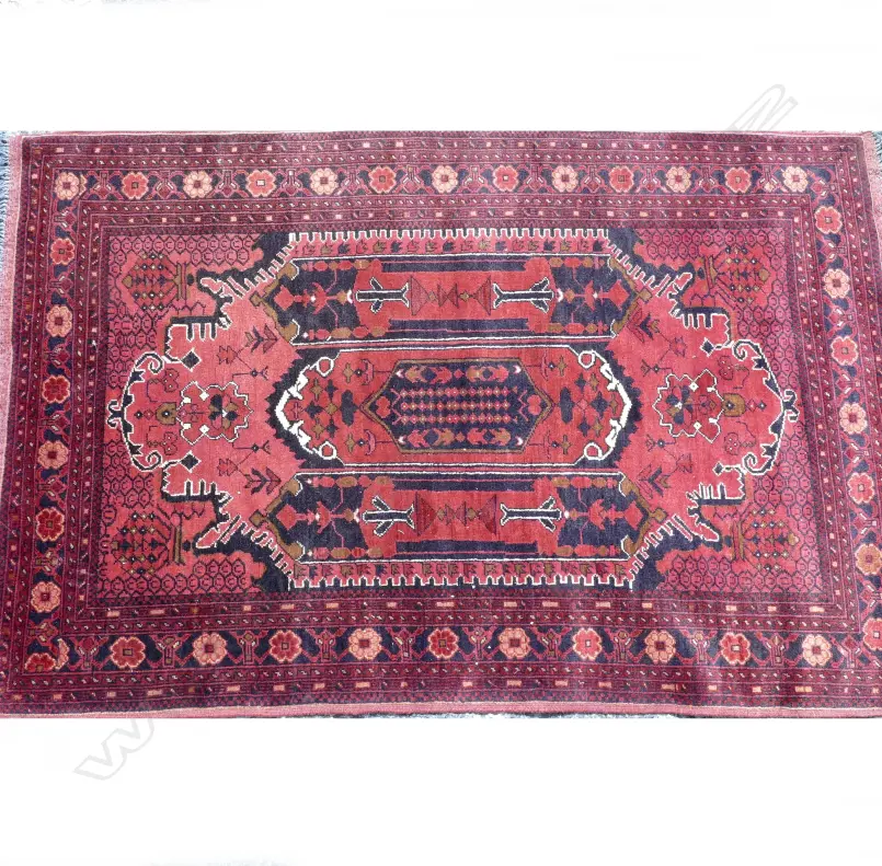 A hand knotted Baluchi tribal rug with stylised floral designs Image 1++