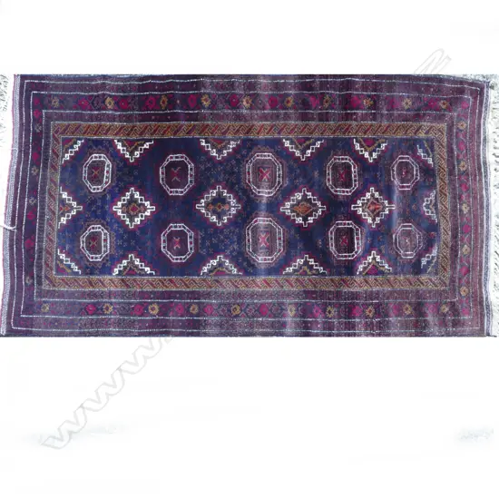 A hand knotted Baluchi tribal rug
