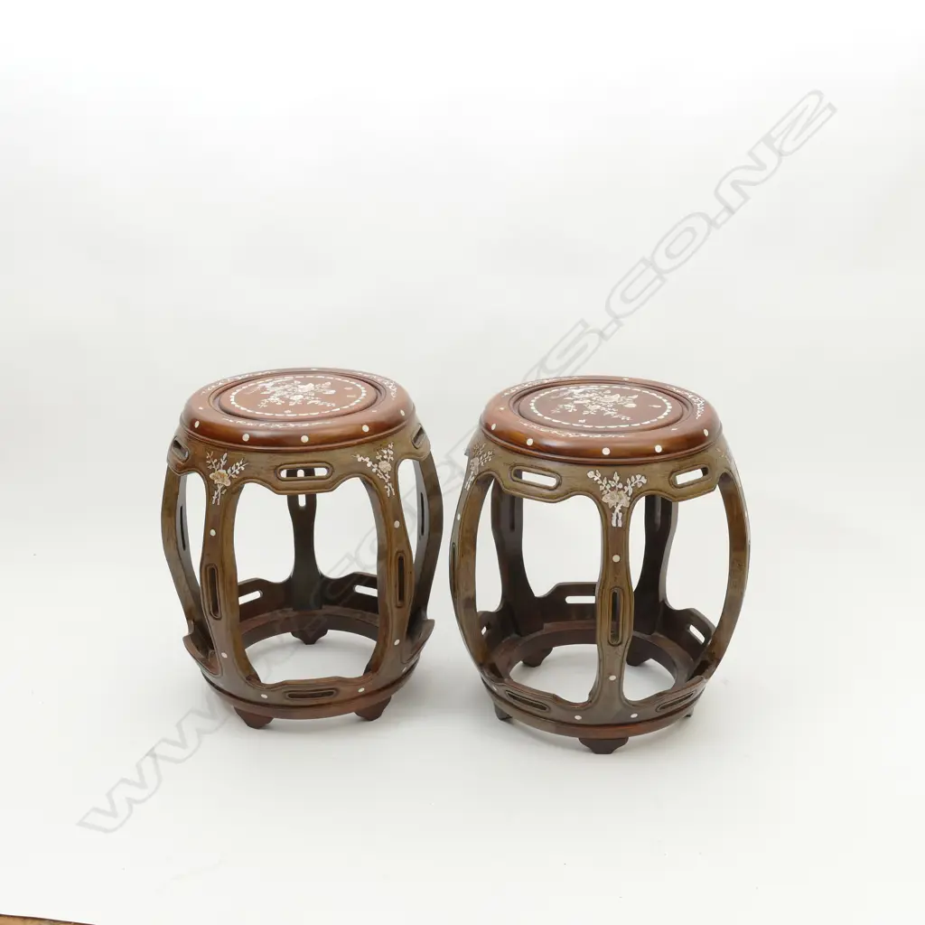 A pair of good quality Chinese hardwood drum stools of traditional design with profuse floral mother of pearl inlay. Diameter 350 Image 1++