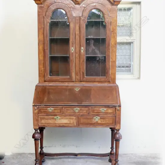 A Queen Anne double-dome bureau bookcase