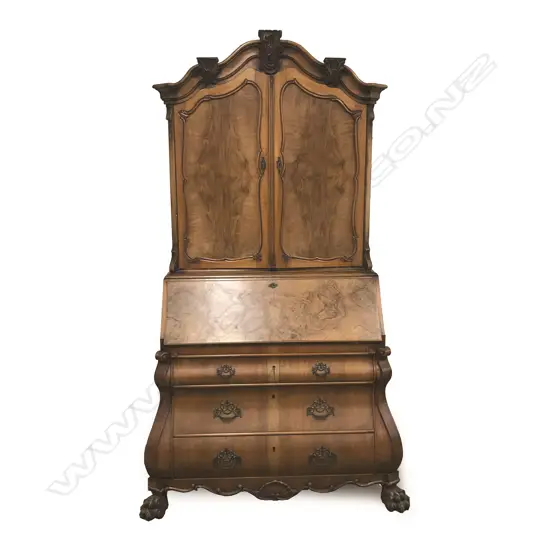 An early 20thC European figured walnut bookcase bureau