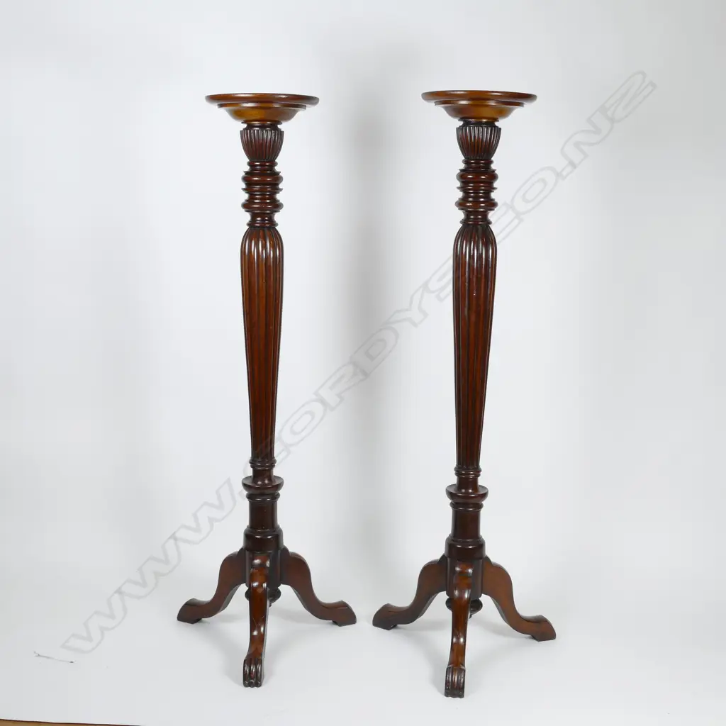 A pair of tall mahogany torchieres Image 1++
