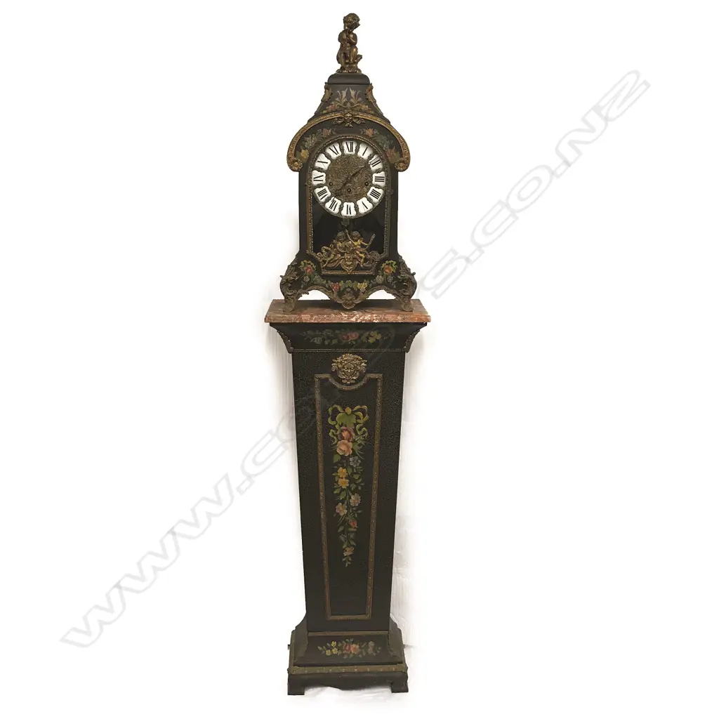 A decorative French style bracket clock raised on stand Image 1++