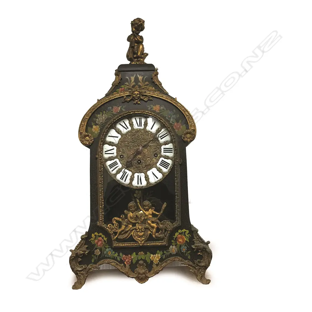 A decorative French style bracket clock raised on stand Image 1++