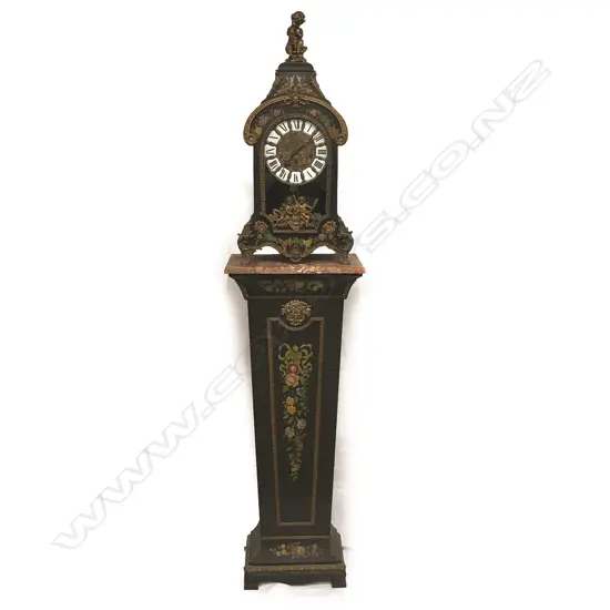 A decorative French style bracket clock raised on stand
