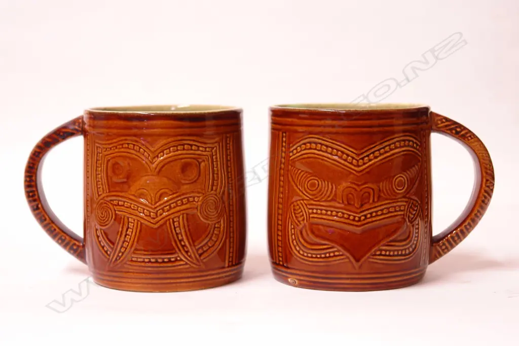 A pair of rare Crown Lynn Wharetana Maori Art Pottery 'Ruru and Weku' drinking mugs Image 1++