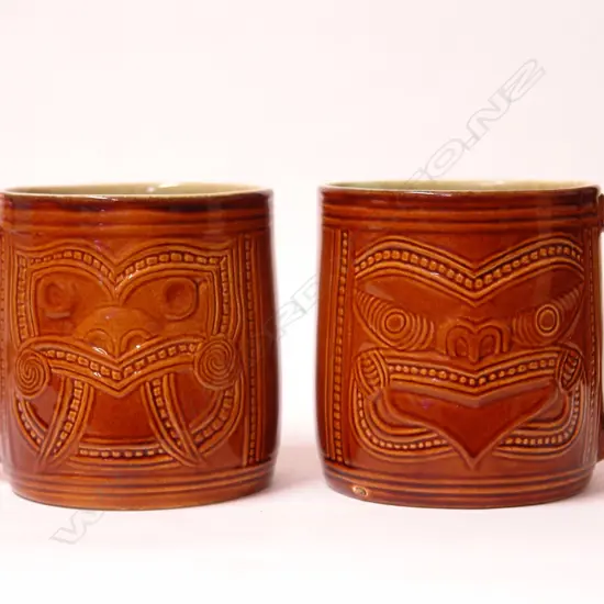 A pair of rare Crown Lynn Wharetana Maori Art Pottery 'Ruru and Weku' drinking mugs