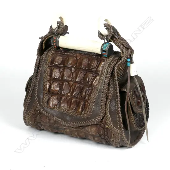 A crocodile skin and leather handbag