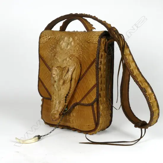 A large crocodile skin handbag
