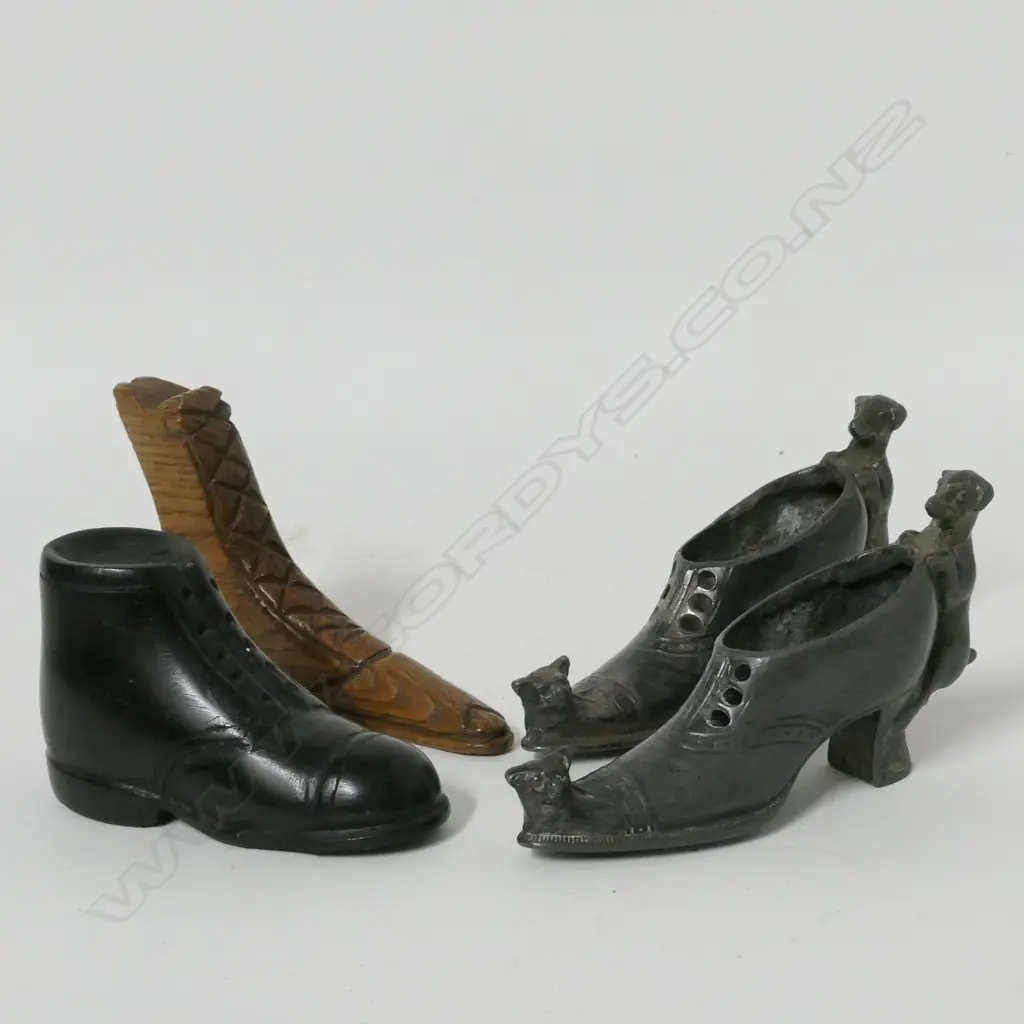 A pair of Victorian pewter pin cushion shoes Image 1++