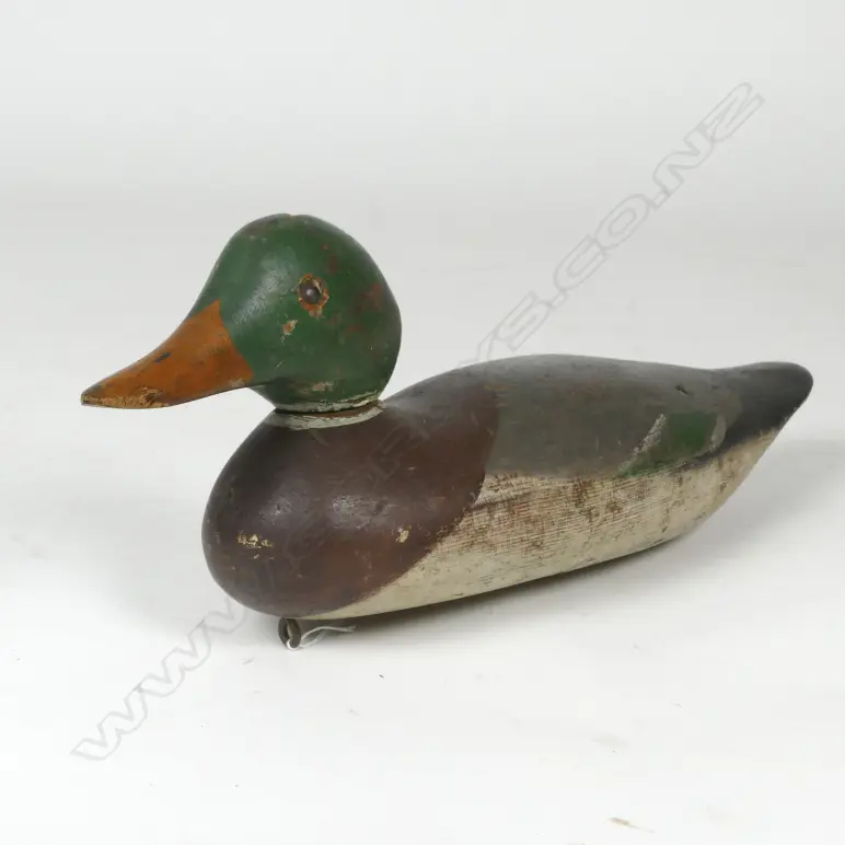 A vintage carved and painted wood duck decoy Image 1++