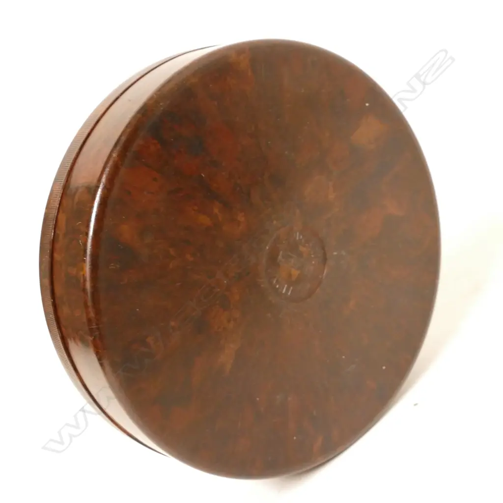 A Hardy's circular Bakelite screw top cast box Image 1++