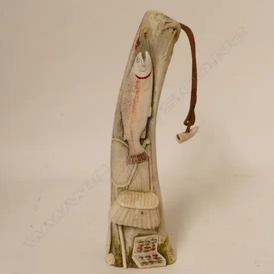 A carved antler cabinet piece anglers 'priest' by Taupo master carver Des Baker