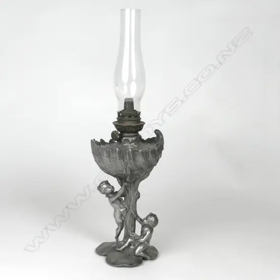 A small unusual late Victorian Art Nouveau pewter Victorian kerosene lamp