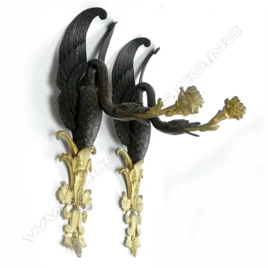 A pair of fine quality French Empire bronze and parcel gilt wall sconces