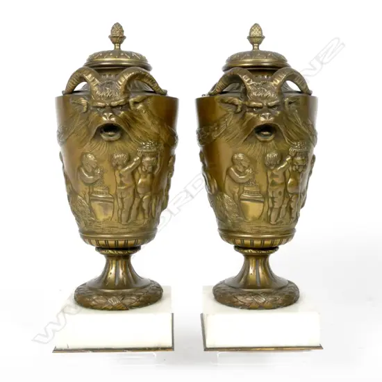 A pair of French 19thC bronze covered urns