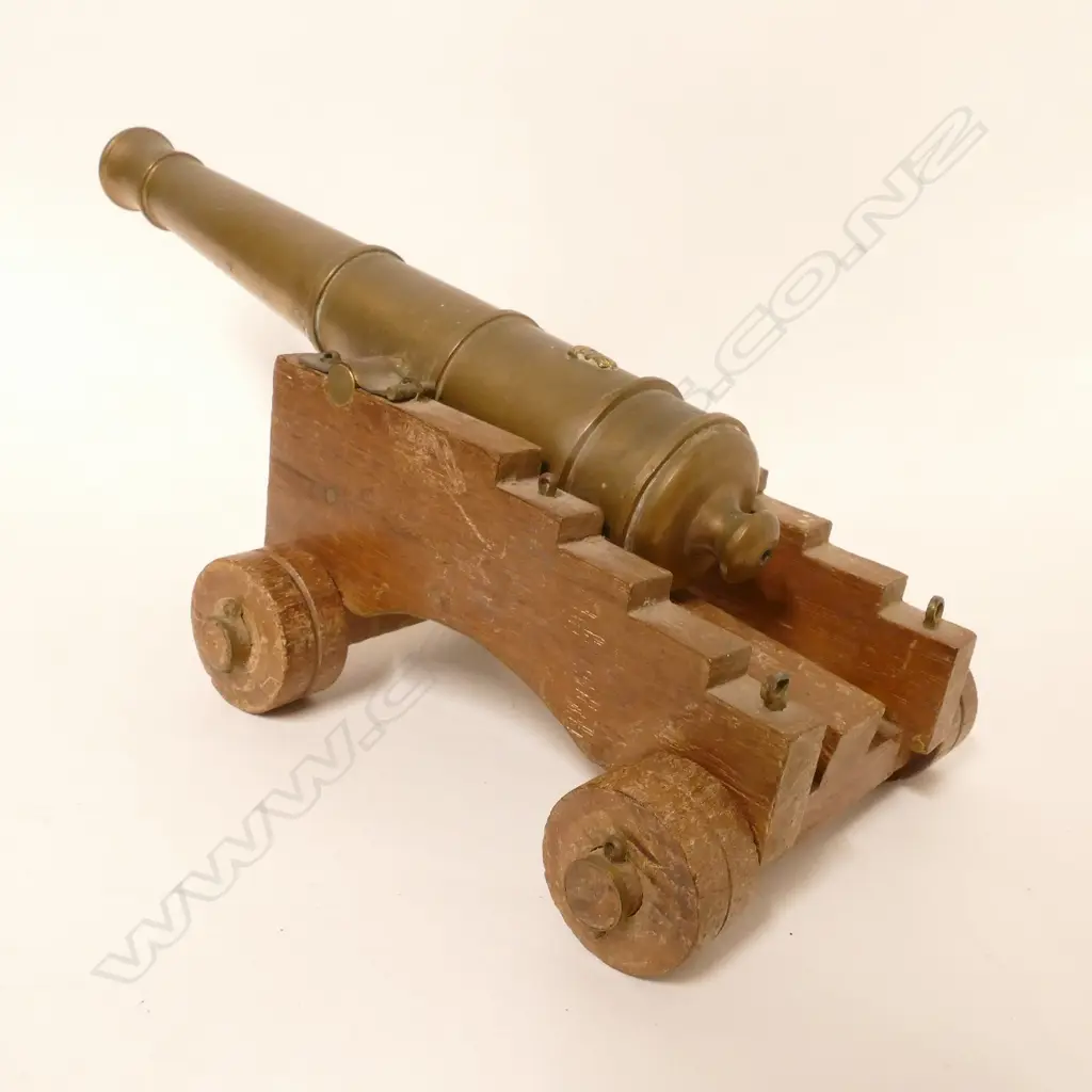 A bronze miniature canon model Image 1++