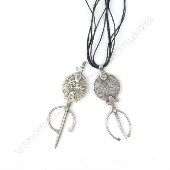 Two Arabic silver coins mounted as cloak pins