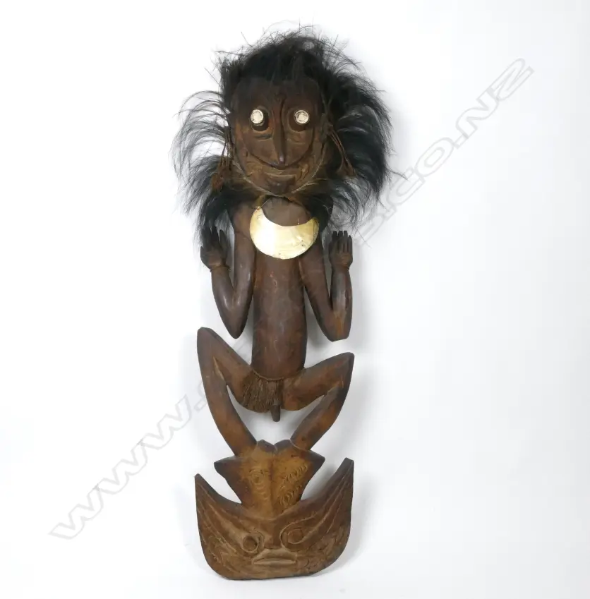 A large old Papua New Guinea carved figural food hook with lyre bird feather headrest Image 1++