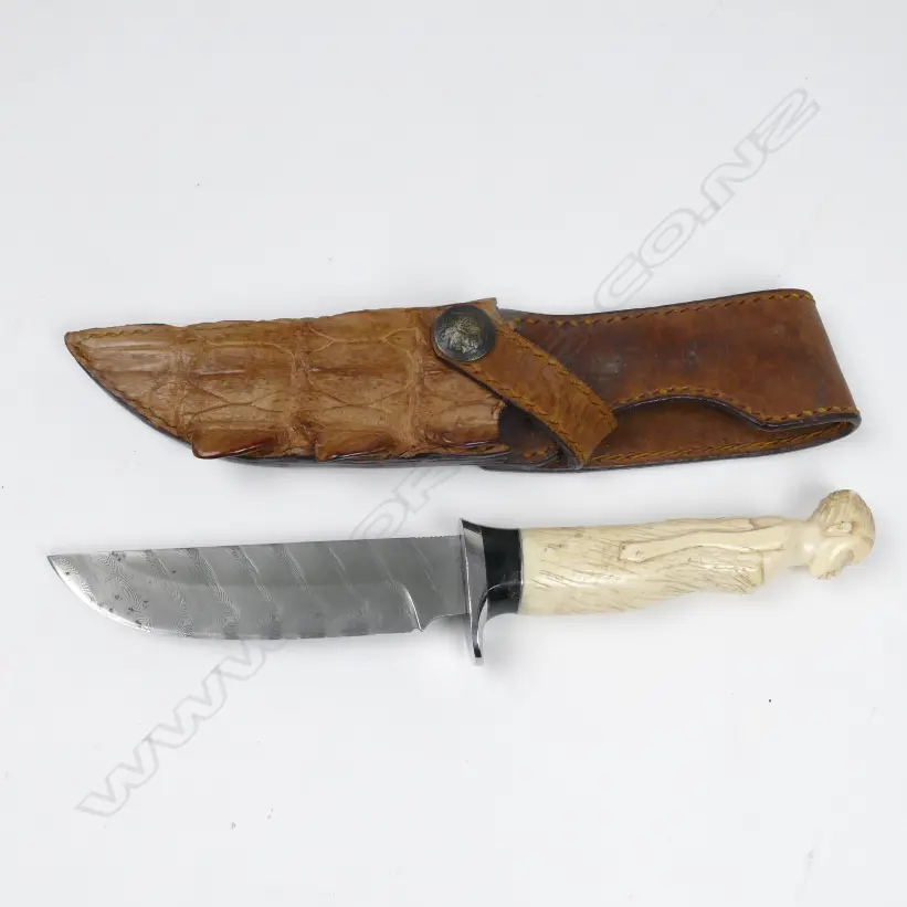 A hunting knife in scabbard Image 1++