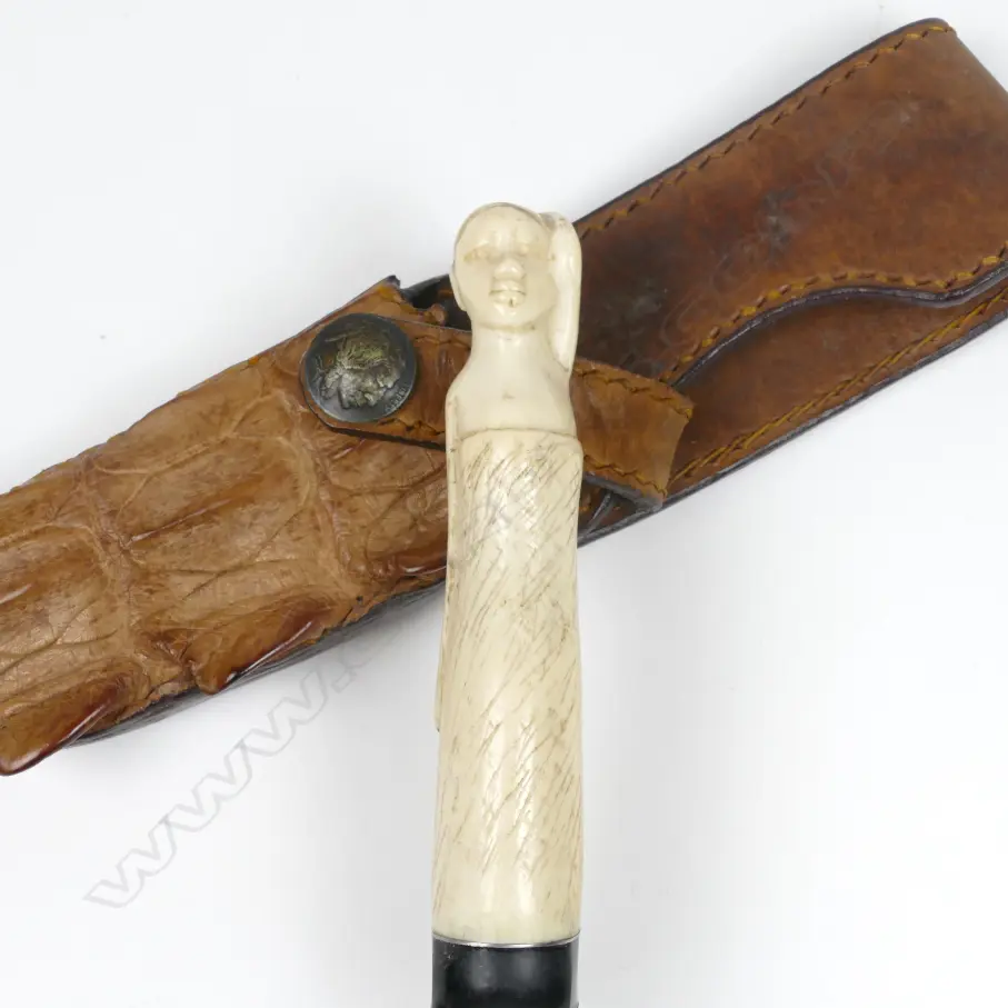 A hunting knife in scabbard Image 1++