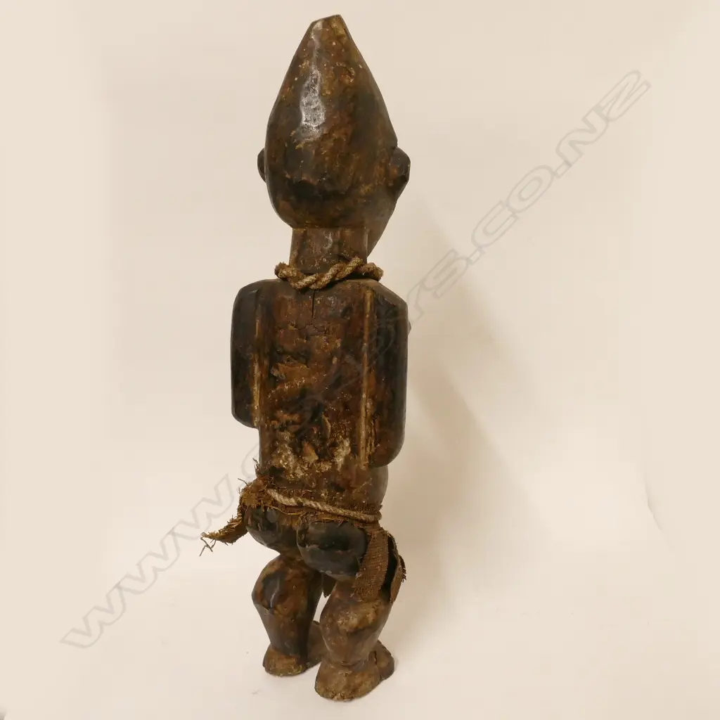 An African carved wooden female figure Image 1++