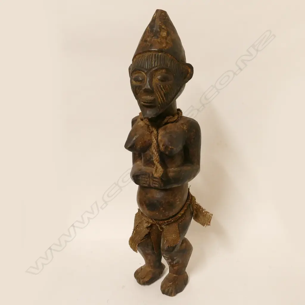 An African carved wooden female figure Image 1++