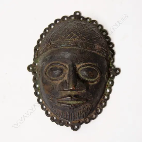 An antique Benin African bronze mask