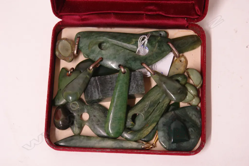 A collection of carved greenstone pendants etc. Image 1++