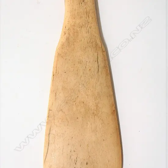 An old Maori carved patu paraoa
