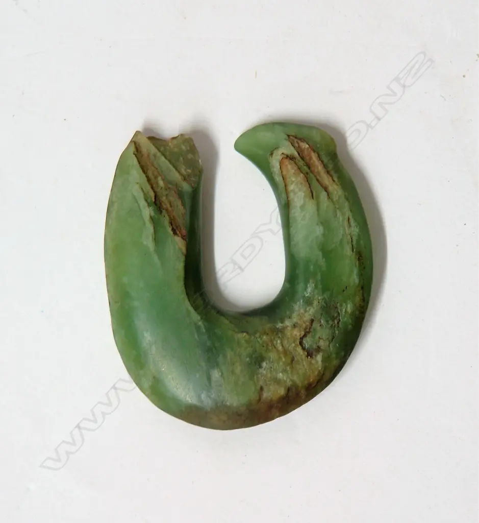 An old Maori pounamu matau (greenstone fish hook) Image 1++