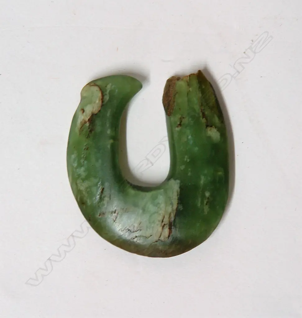 An old Maori pounamu matau (greenstone fish hook) Image 1++