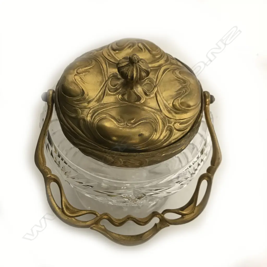 A decorative cut crystal biscuit barrel of baluster shape Image 1++