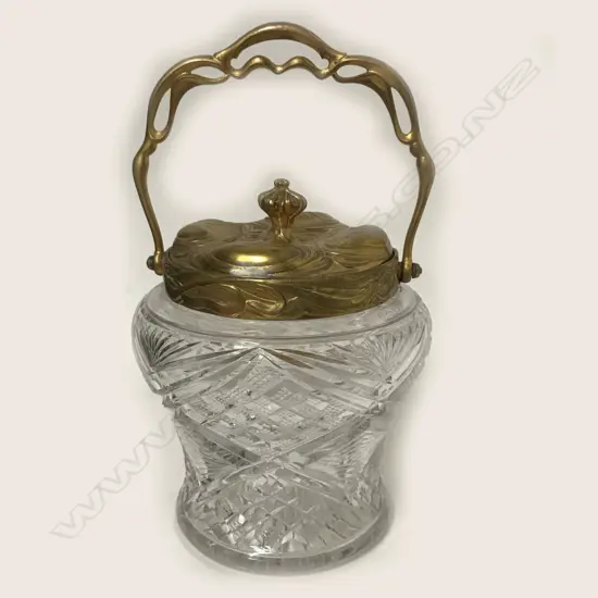 A decorative cut crystal biscuit barrel of baluster shape