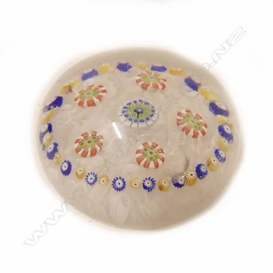 A 19thC attributed Clichy or Baccarat millefiori and latticino glass paperweight