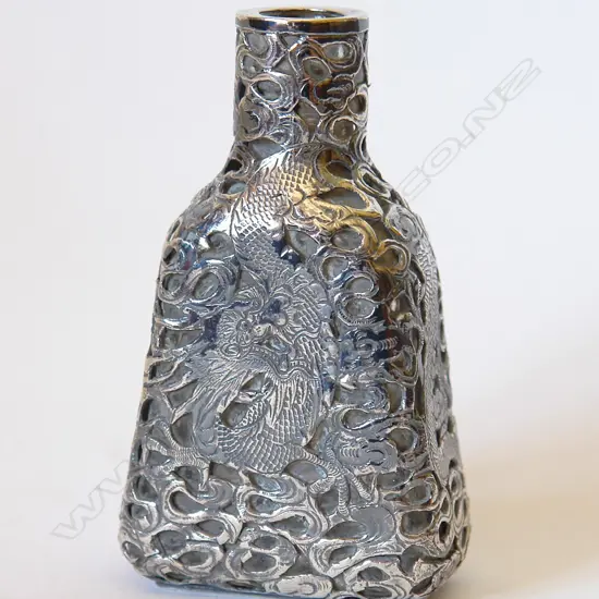 A c.1900 Chinese trade silver overlay glass perfume bottle