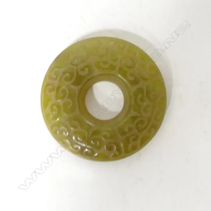 A Chinese yellow/green jade bi disc Image 1++