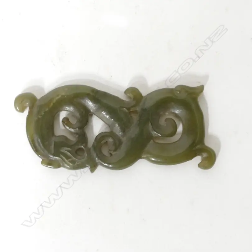 A Chinese brown/green jade carving of a sinuous qilin Image 1++