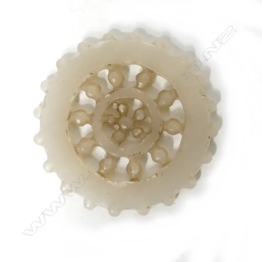 A Chinese white jade carved Buddhist wheel Image 1++