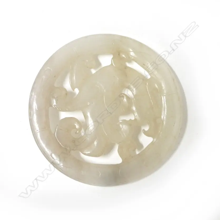 A Chinese muttonfat jade circular pendant disc Image 1++