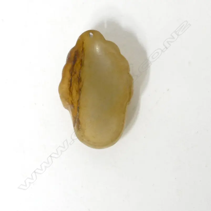 A Chinese pale brown jade pendant mask of Kuanyin Image 1++