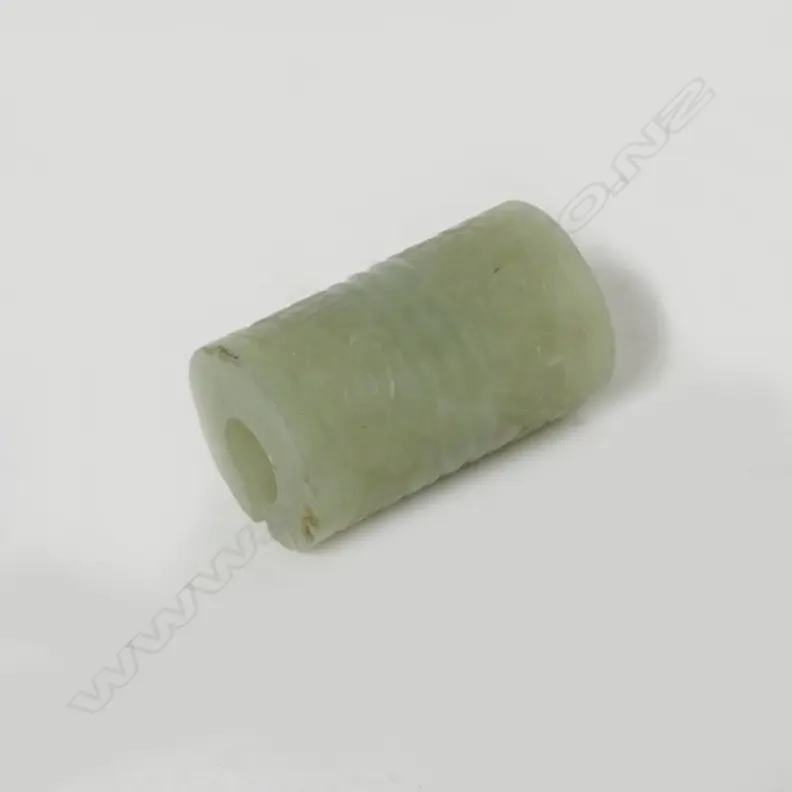 A Chinese pale green jade cylindrical bead Image 1++