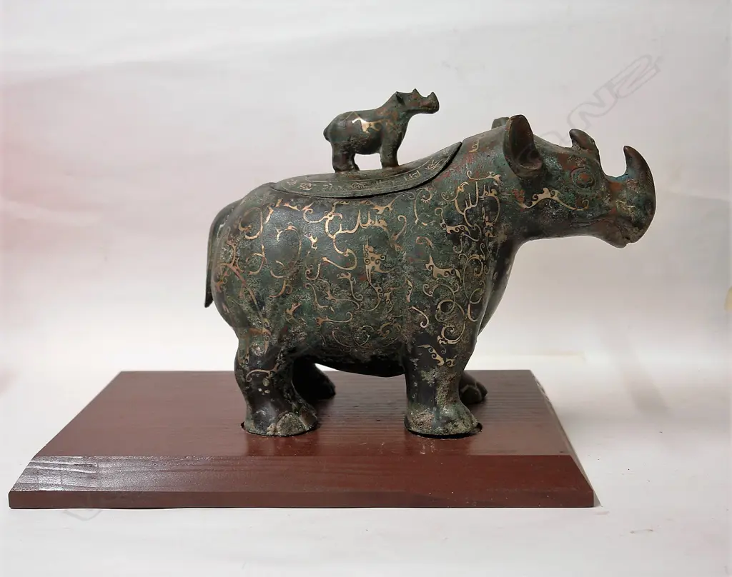 A Chinese archaic style bronze rhinoceros lidded vessel Image 1++