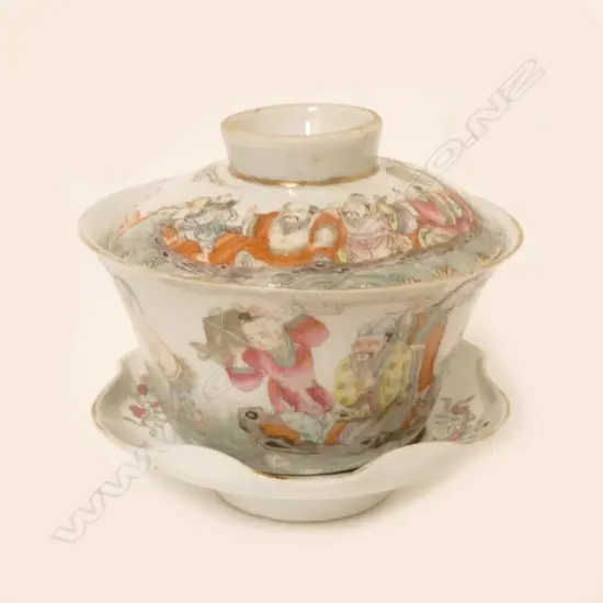 A Chinese famille rose porcelain tea bowl and cover on associated saucer