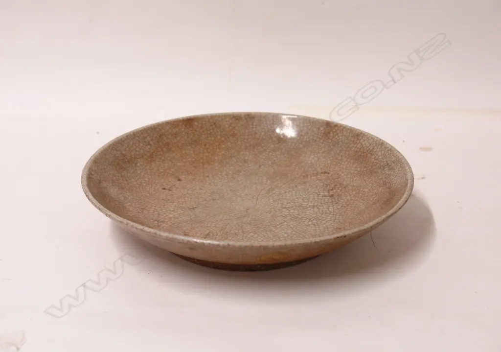 An early Sung Provincial celadon crackleware dish Image 1++
