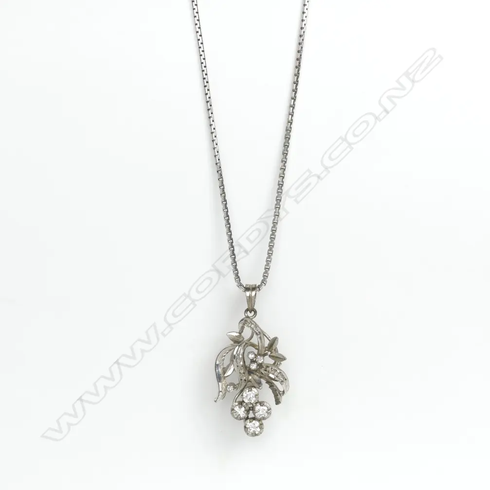 An 18ct. white gold and diamond pendant Image 1++