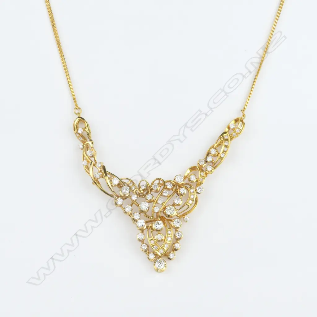 An 18ct. gold and diamond suite Image 1++