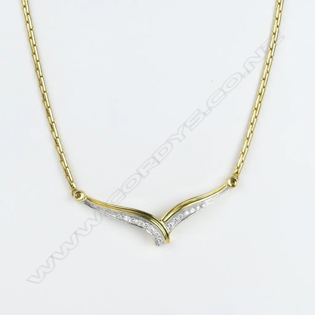 An 18ct gold and diamond necklace and bangle Image 1++