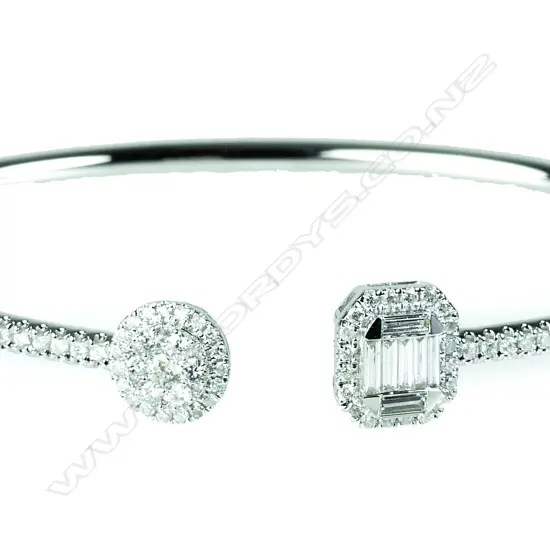 A lady's 18ct. white gold and diamond bangle